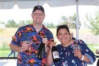 Two people purchasing hard cider