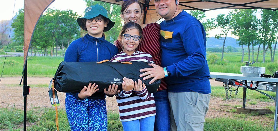 A family poses for a photo during the event.