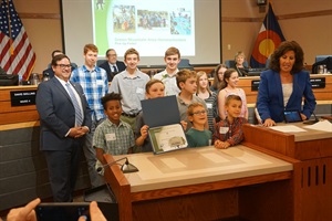 Youth pose with mayor for sustainability awards