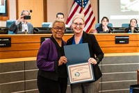 Mayor Strom posing with a woman