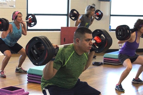 A strength training BodyPump class takes place.
