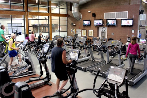 Visitors work out in the cardio equipment area of Whitlock Rec Center.