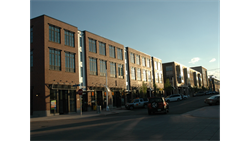 exterior shot of a building with shadows in the distance